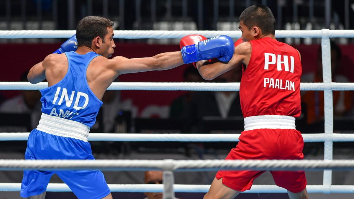 Amit Pangal stuns Olympic champion to clinch gold Amit Pangal stuns Olympic champion to clinch gold